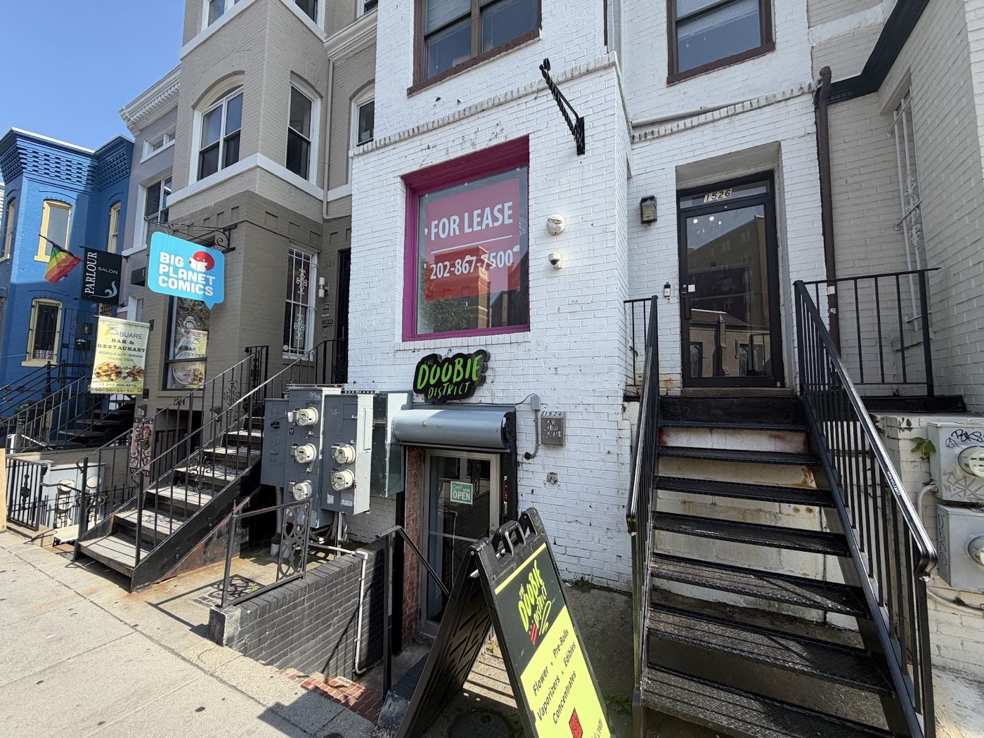 Doobie District storefront at 1526 U Street NW, with the green sign, sidewalk sign and steps down to the basement entrance